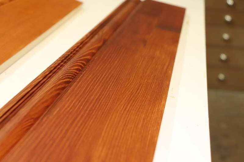 Close up of dark stained finger joint pine