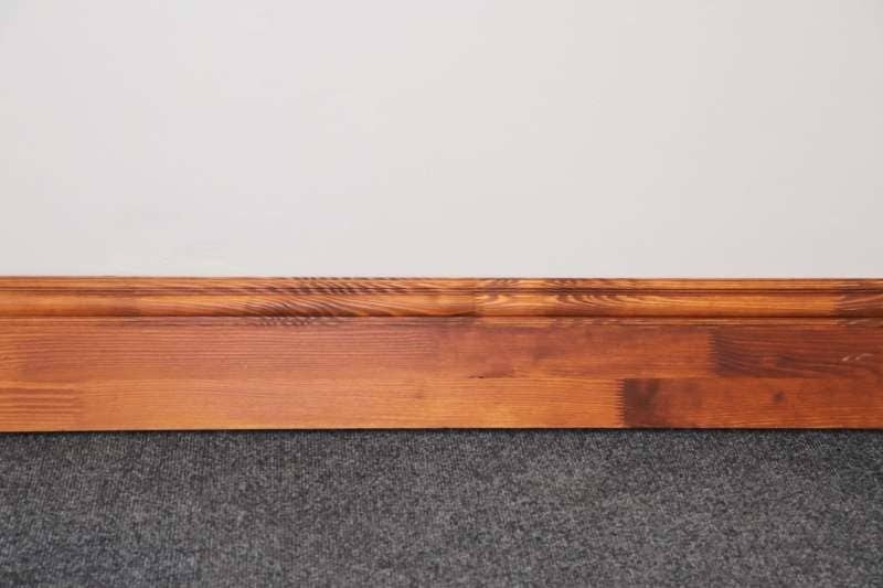Dark stained finer joint pine skirting board